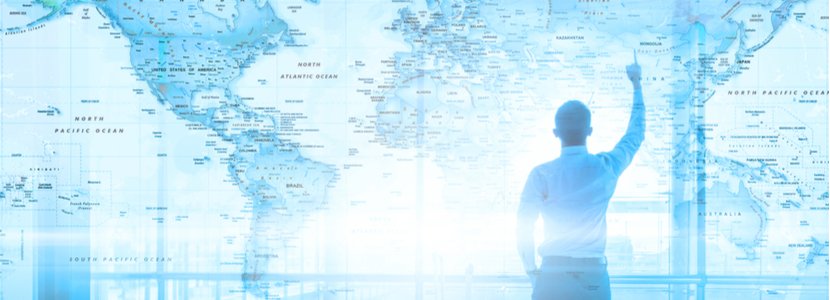 Project Manager looking at a map of the world