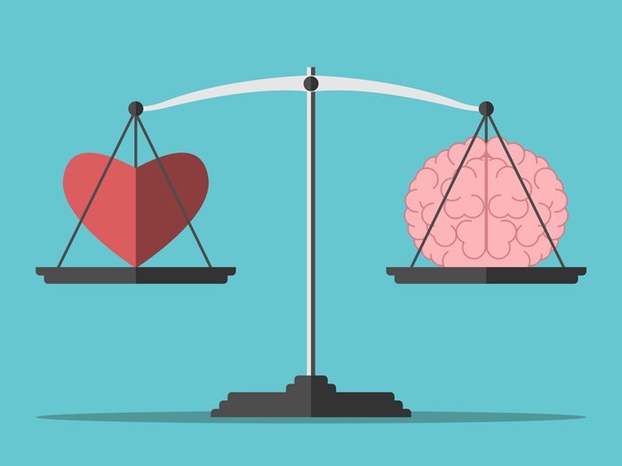 Heart and brain on a scale to represent emotional intelligence