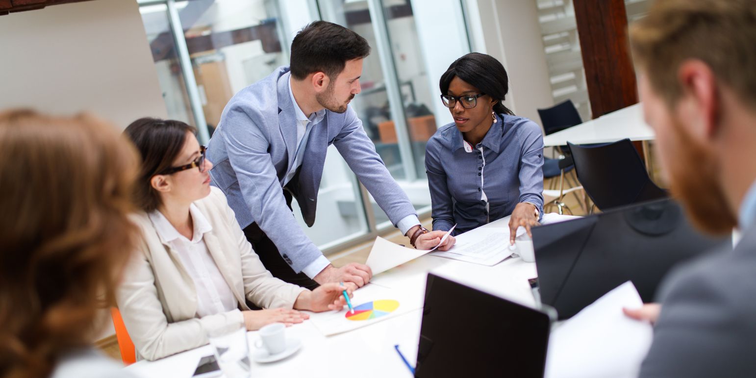 people in an office discussing